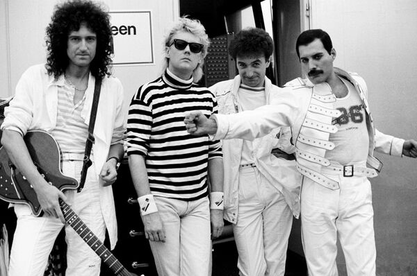 A black and white photo of Queen. 