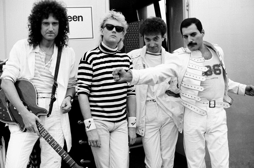 A black and white photo of Queen. 