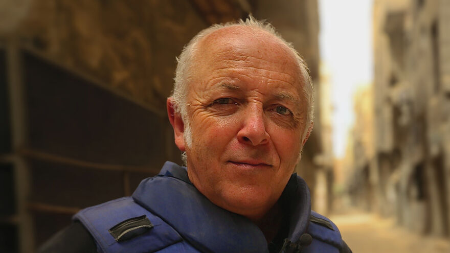 Jeremy Bowen looks at the camera