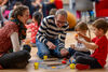 Family on floor with arts and crafts