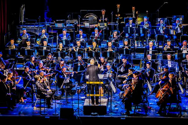 A wide shot of the BBC Concert Orchestra performing on stage.