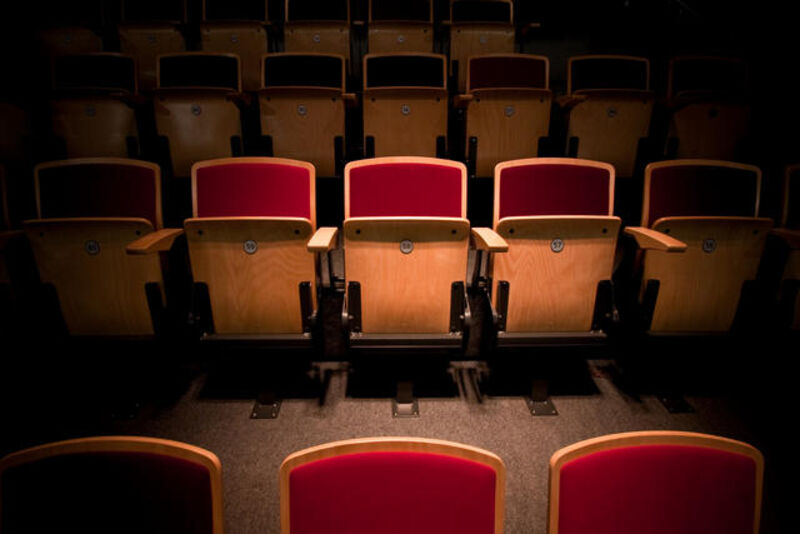 Close-up photo of the red velvet chairs in the Butterworth Hall