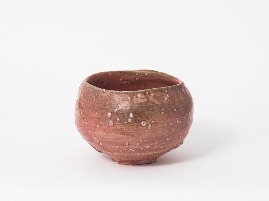 A small ceramic pot on a white background