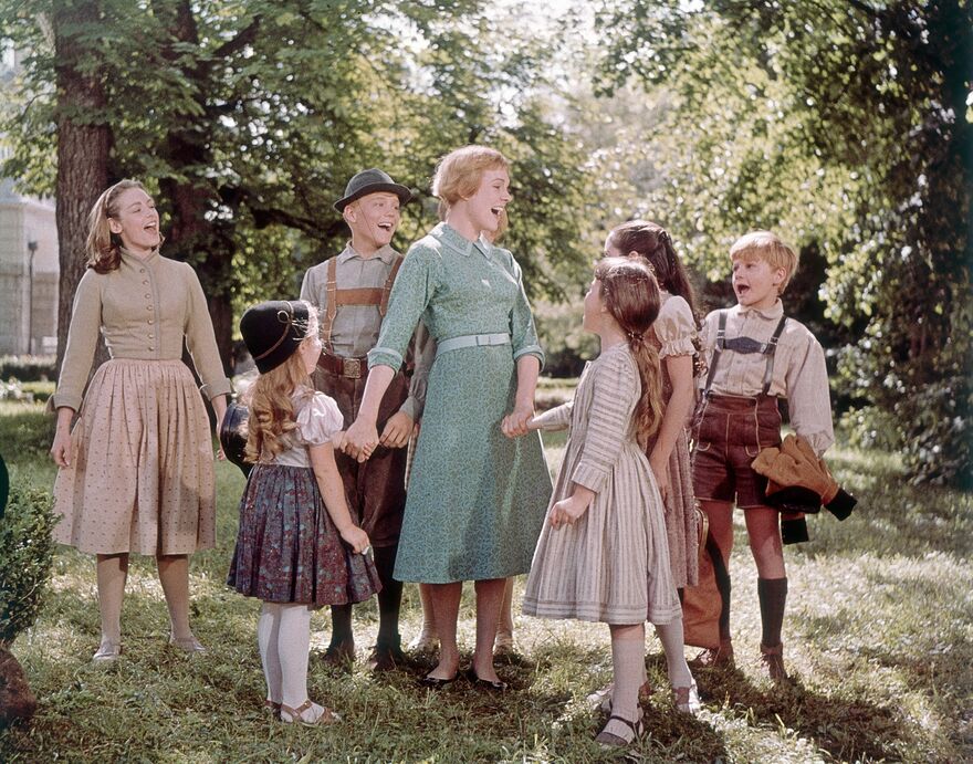 Maria and the 7 Von Trapp children singing. 