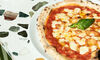 A margherita pizza on a a table