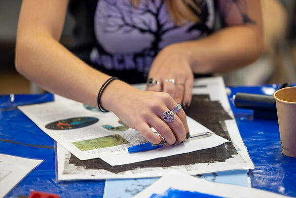 Close up of hands lino printing 