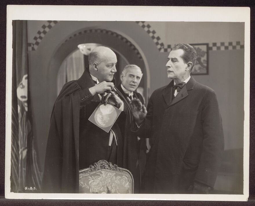 A black and white image of Eille Norwood as Sherlock Holmes. 