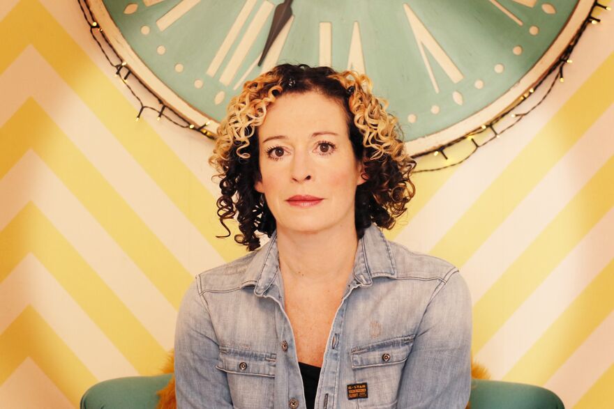 Kate Rusby sat in a denim jacket