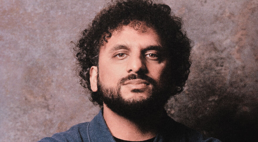 Nish looks at the camera 