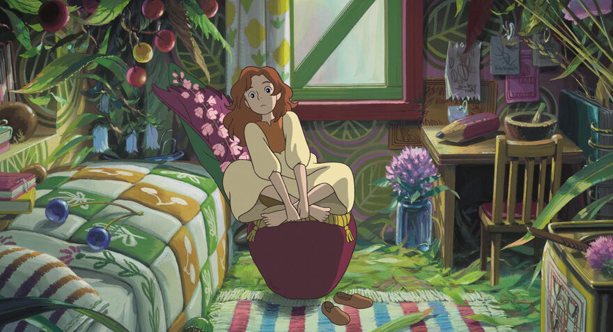 An anime image of a girl sat cross legged on a stool in a bedroom. 