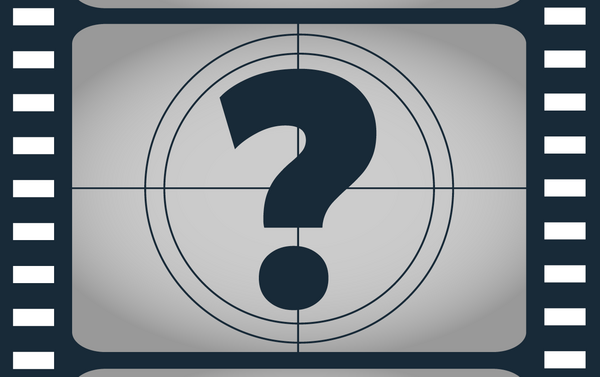 A black and white image of a question mark within a film reel.