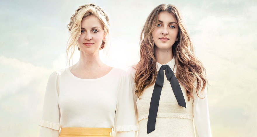 Catherine and Lizzy Ward Thomas stood in front of a bright cloudy sky