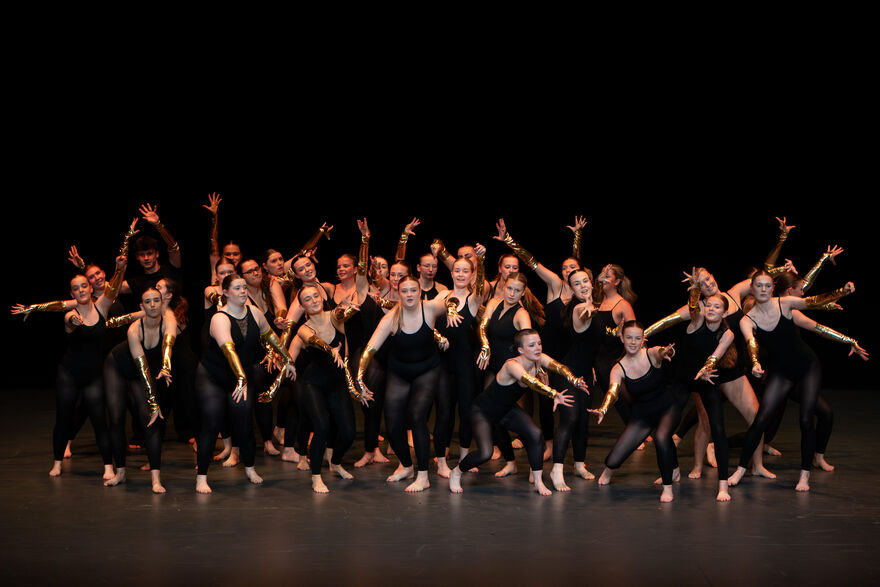 University of Warwick Classical & Modern Dance members in the middle of a stage performance.
