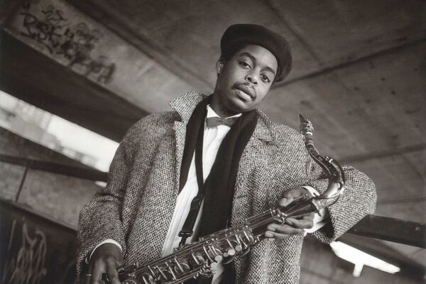 Courtney Pine holds a saxophone to the camera 