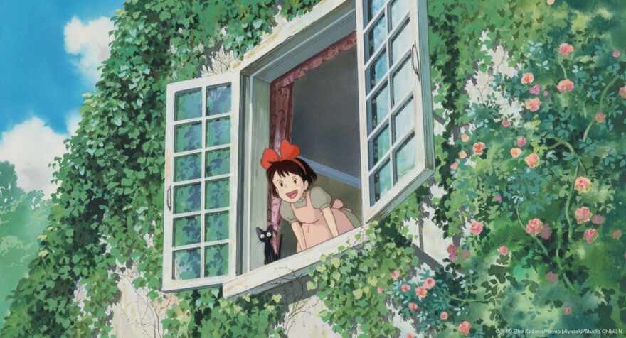 An anime image of a young girl leaning out of a window with a black cat. The window is covered in greenery and flowers. 