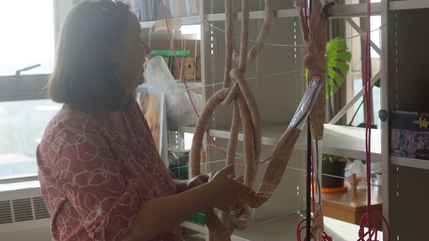 Artist Janet Tryner working on a sculpture