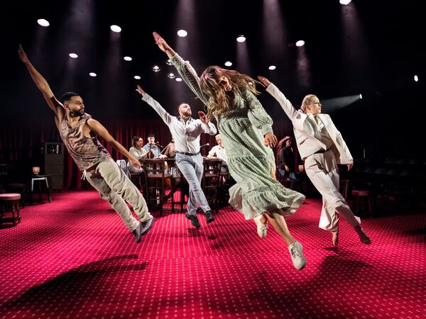4 Dancers jumping in a pub setting