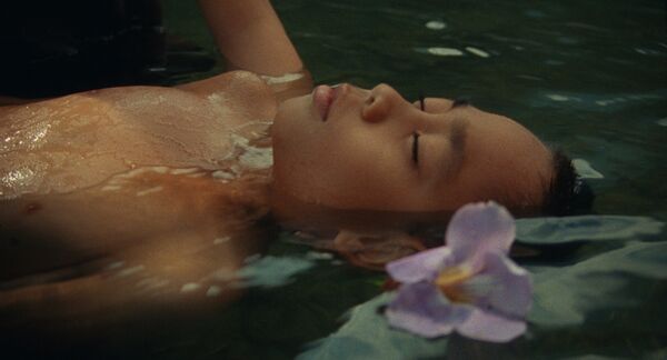A young boy floating in water. 