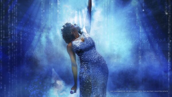 Whitney Houston Impersonator with hand in the air 