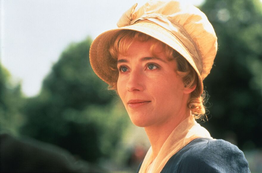 A woman in period dress smiles softly 