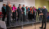 A group of people on stage singing