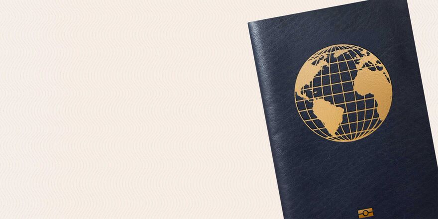 A dark blue passport against a pale background