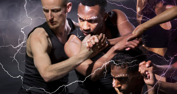 Dancers holding hands with lightning around them