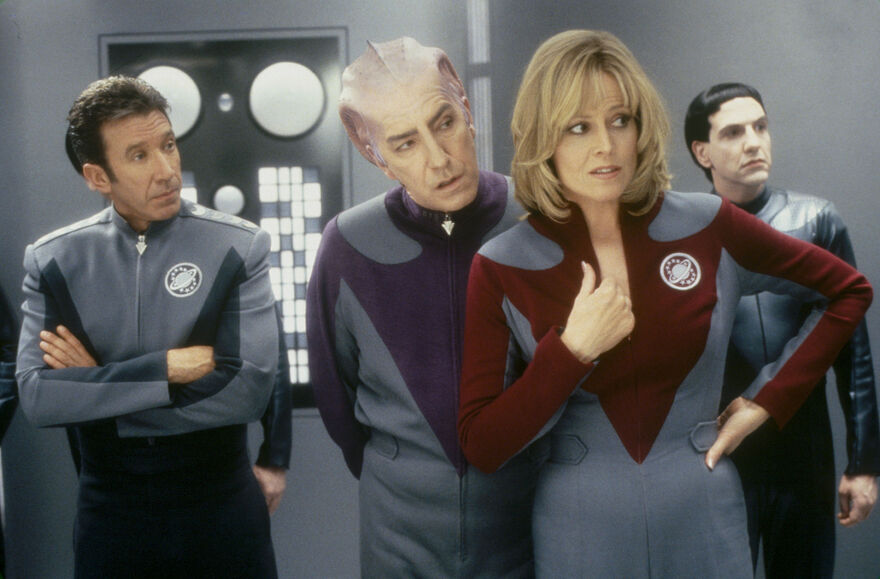 A group of four actors in space suits. 
