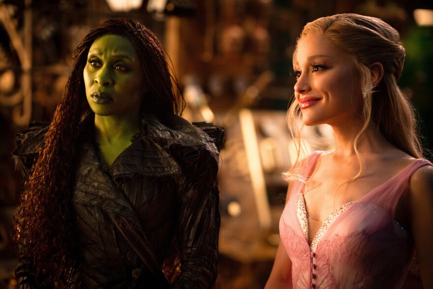 Thw witches of oz, Glinda smiling Elphaba  looking concerned