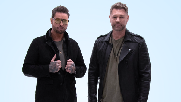 Keith Duffy and Brian McFadden standing next to each other