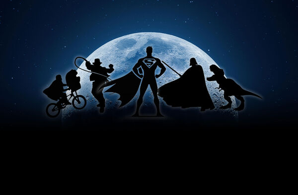Silhouettes of film characters against a moon landscape