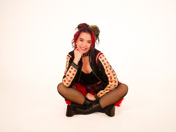 Ria Lina sat with legs crossed