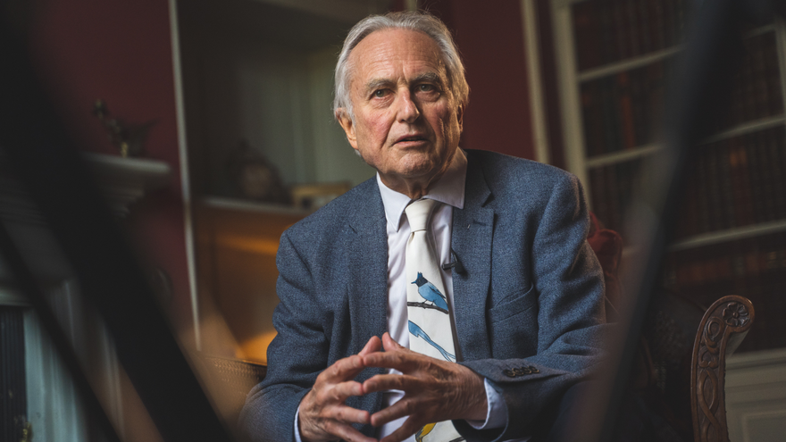 Richard Dawkins sat with hands togther