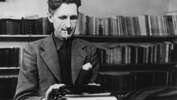 A black and white photograph of George Orwell. 
