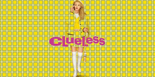 Alicia Silverstone as Cher. Her yellow outfit blends into the chequered yellow pattern background. 