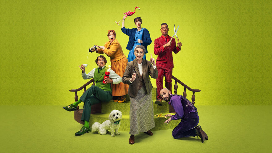 A group of people stood on a set of stairs: One holding dynamite, one holding a banana peel, one holding a flamingo, one holding garden shears , one holding a bottle of poison and one holding a magnifying glass