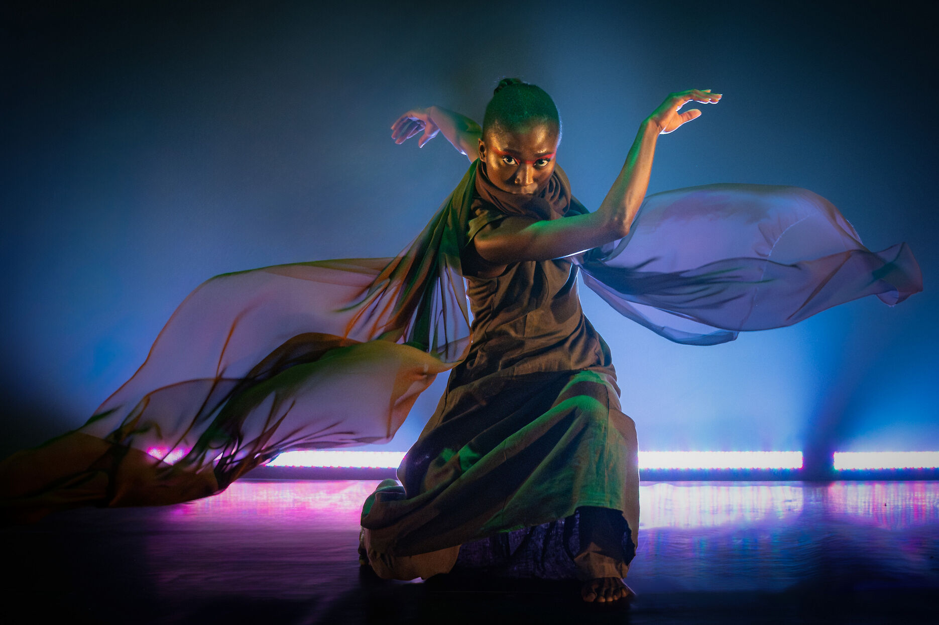 Woman dancing in a flowing dress