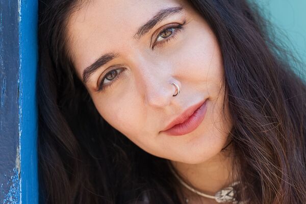 A close-up portrait of author Nikita Gill.