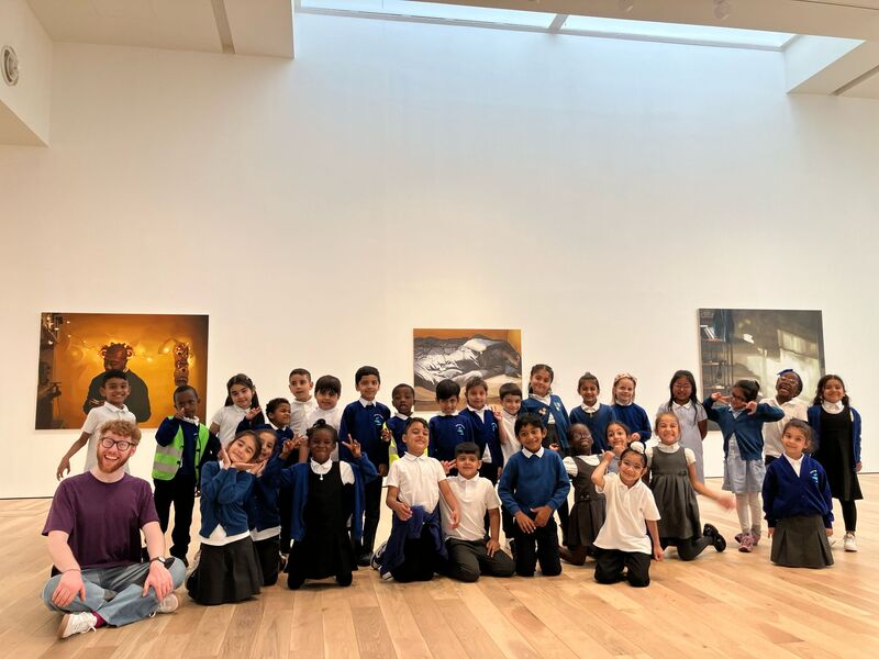 Group of children stood in an art gallery 