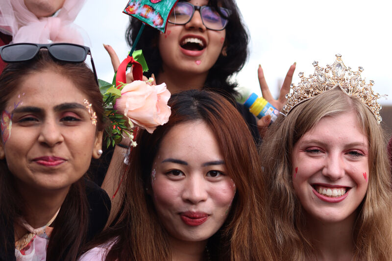 Four smiling young women celebrating at the Canley parade.