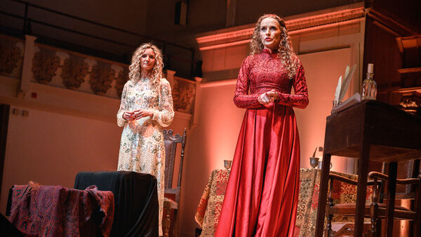 Suzannah Lipscomb and Kate William on stage in long dresses