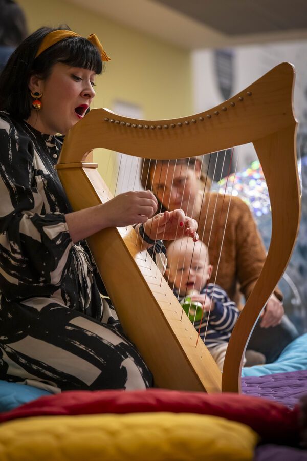 Woman playing a harp