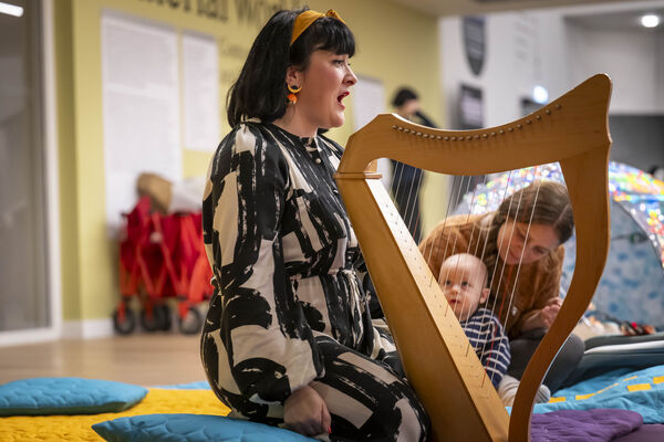 Woman playing a harp