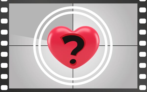 A largely black and white image of a question mark within a vibrant red heart. 