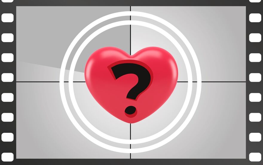 A largely black and white image of a question mark within a vibrant red heart. 