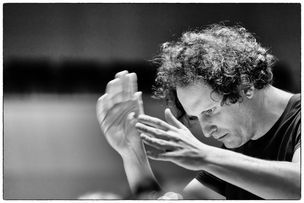 Alexander Bloch with hands in motion, image in black and white