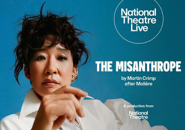 Sandra Oh in a white top against an aqua blue background. 