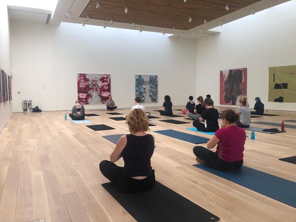 People practicing yoga in the Mead Gallery