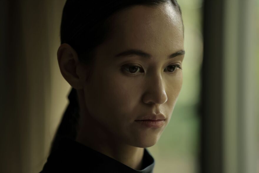 A close-up of a woman looking down