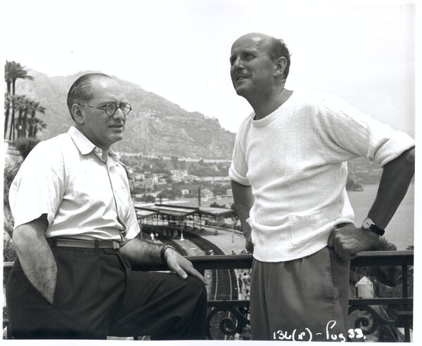 A black and white image of Powell and Pressburger on a balcony. 